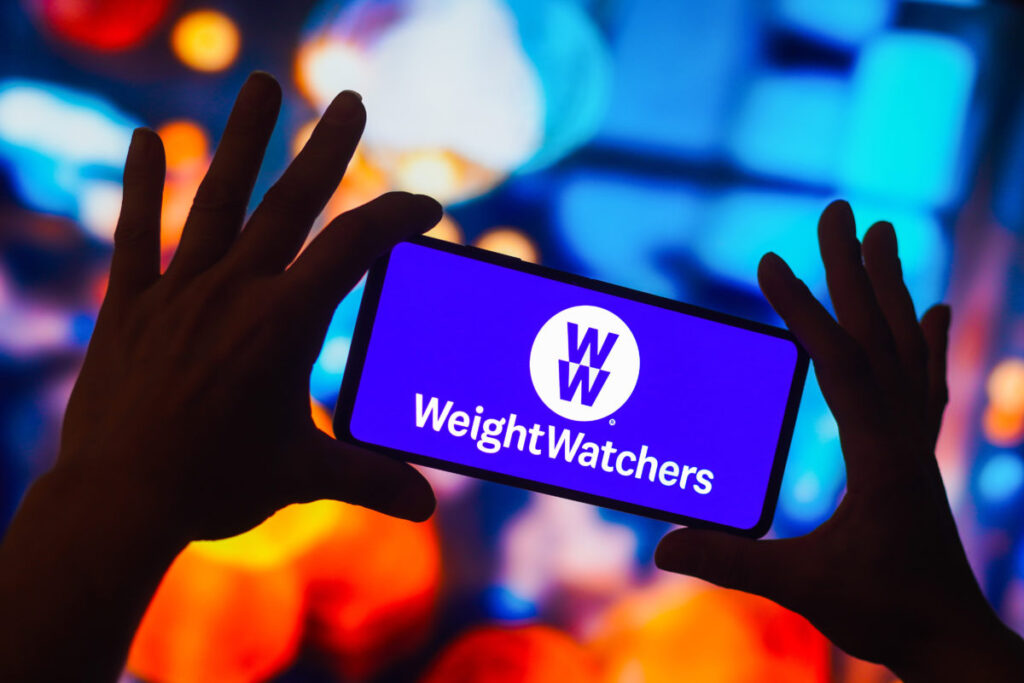 WeightWatchers and Amazon logos with prescription boxes symbolizing GLP-1 weight-loss drug partnership.